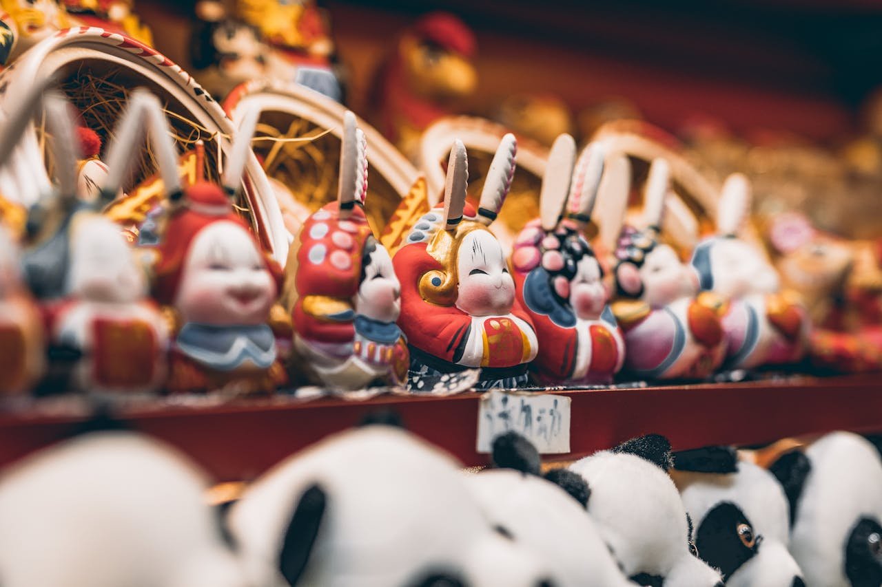 Contact Vibrant rabbit figurines displayed in a Beijing shop, showcasing traditional Chinese design and craftsmanship.